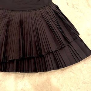 Pleated tennis skirt with asymmetrical front
